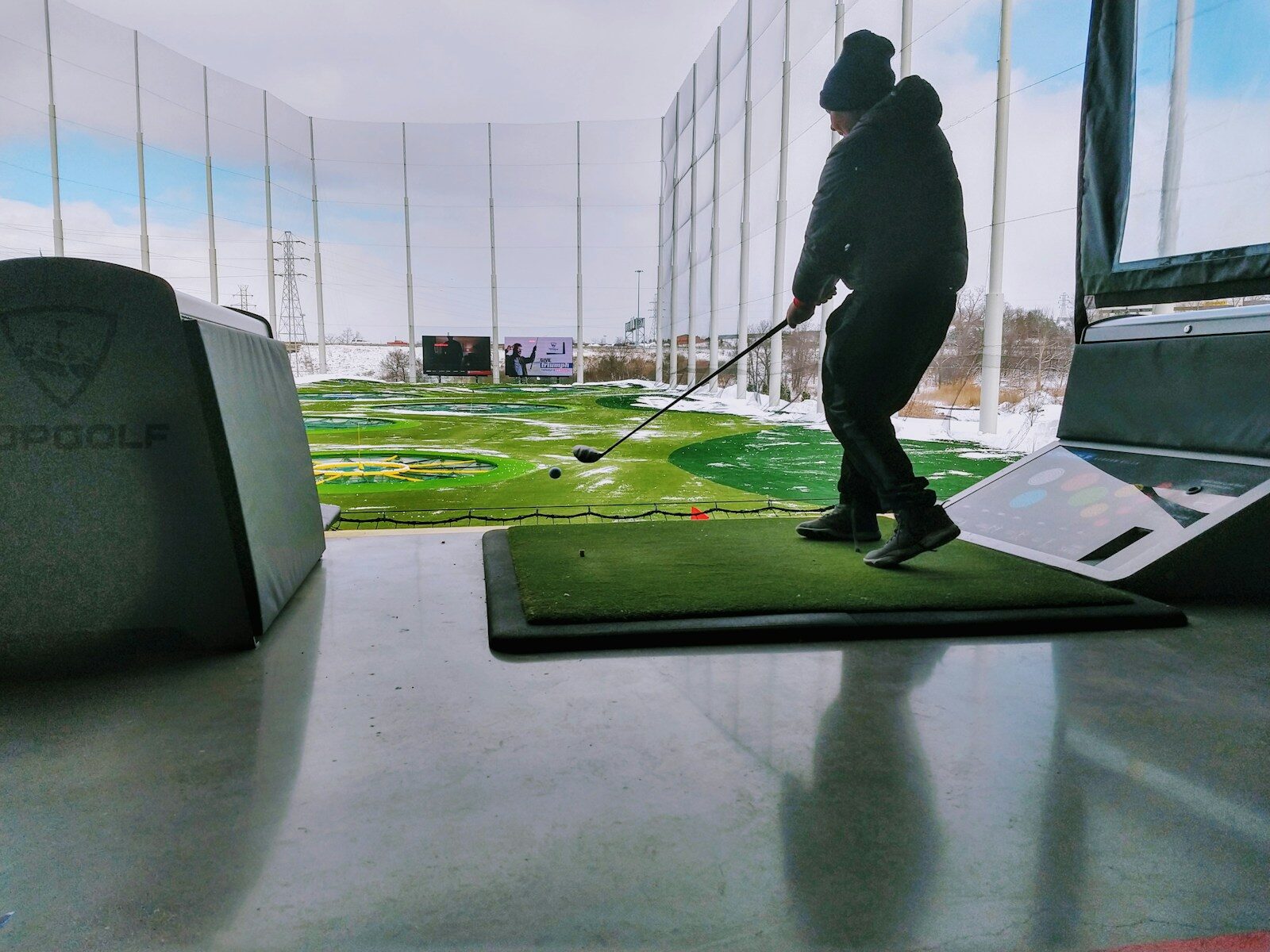 man playing golf during daytmie Experience the Best of Topgolf Myrtle Beach: Fun, Food, and Golfing