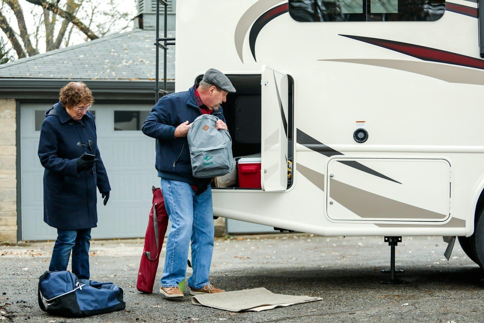 man in blue denim jeans standing beside white car Best Places for Snowbirds to Stay Near Myrtle Beach This Winter