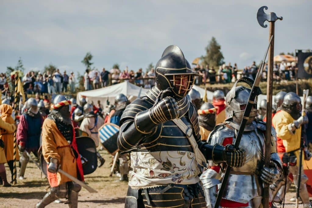 Knights in armor at a historical reenactment event