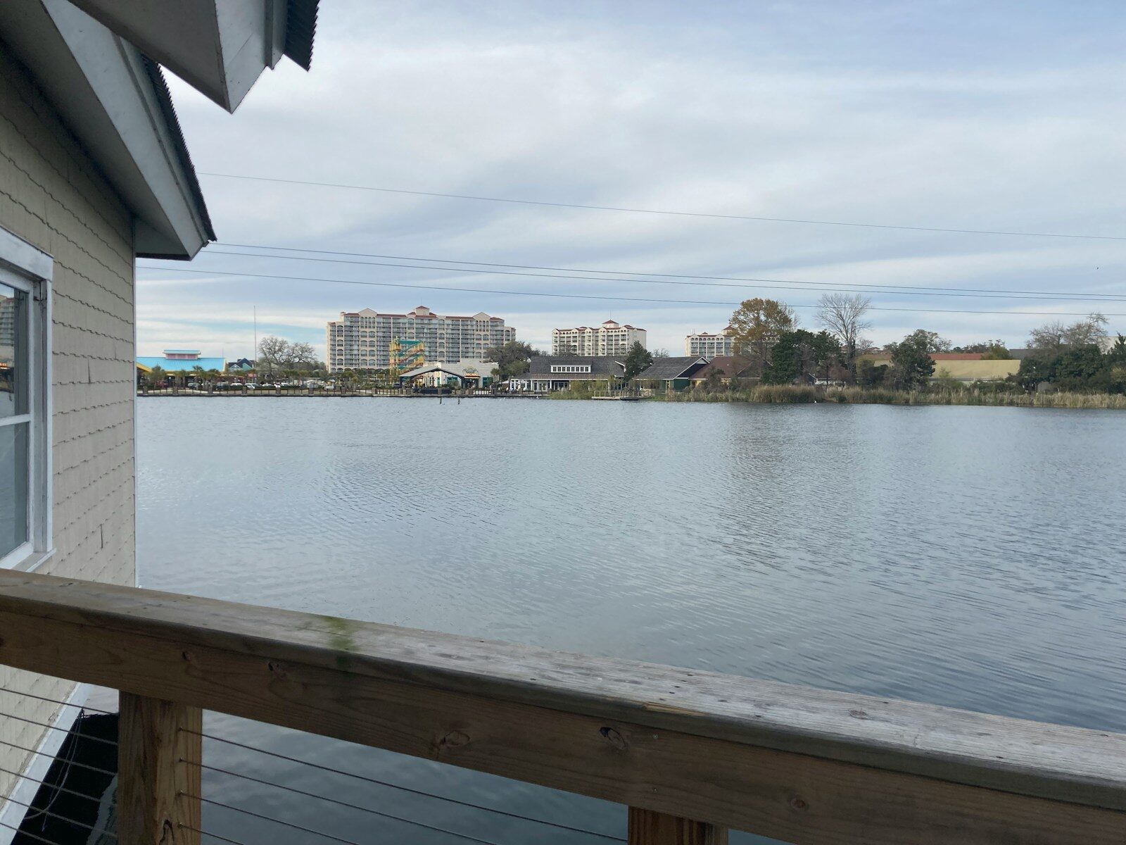 a view of a body of water from a deck The Best Activities at Barefoot Landing Myrtle Beach for All Ages