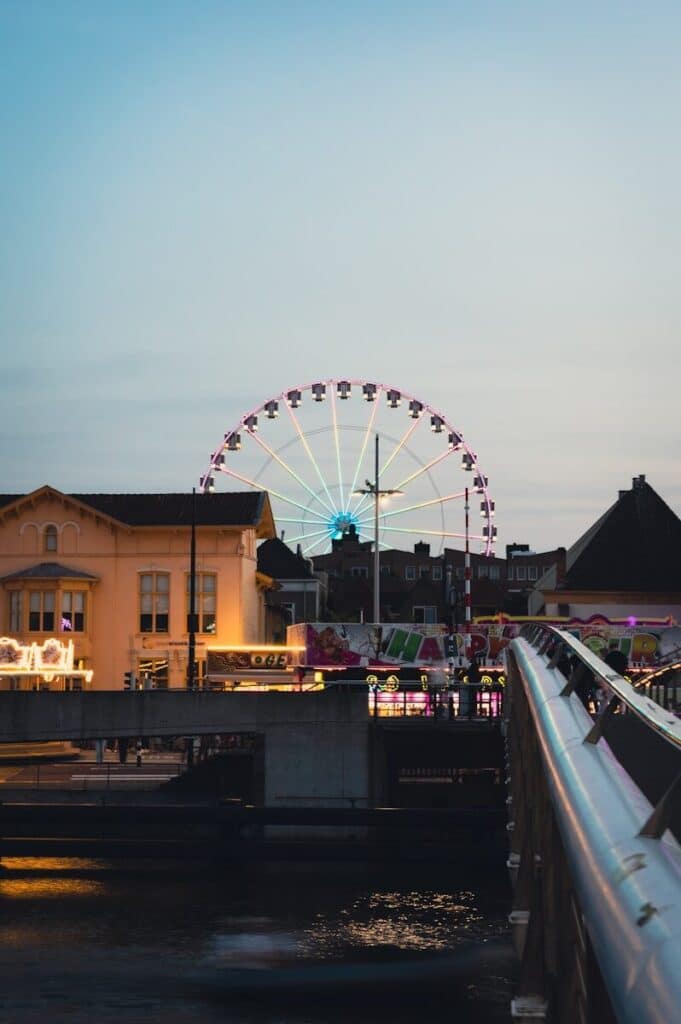 A ferris wheel and a ferris wheel in the distance