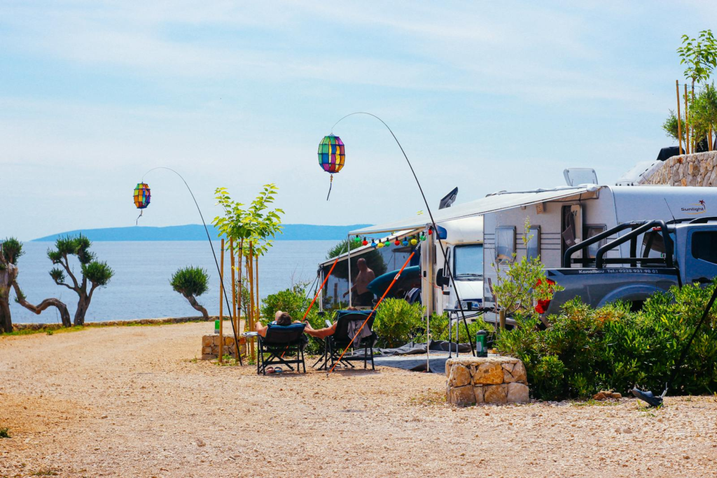 Relaxing RV camping with vibrant lanterns and sea view in Novalja, Croatia.
