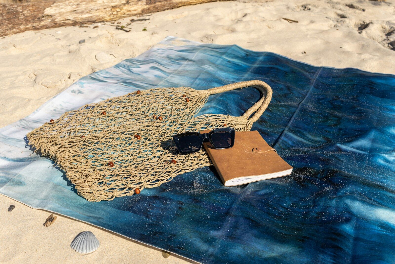 Beach essentials on a towel, ready for a relaxing day.