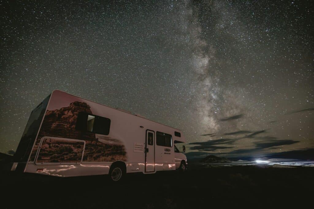 Rv parked under a starry night sky