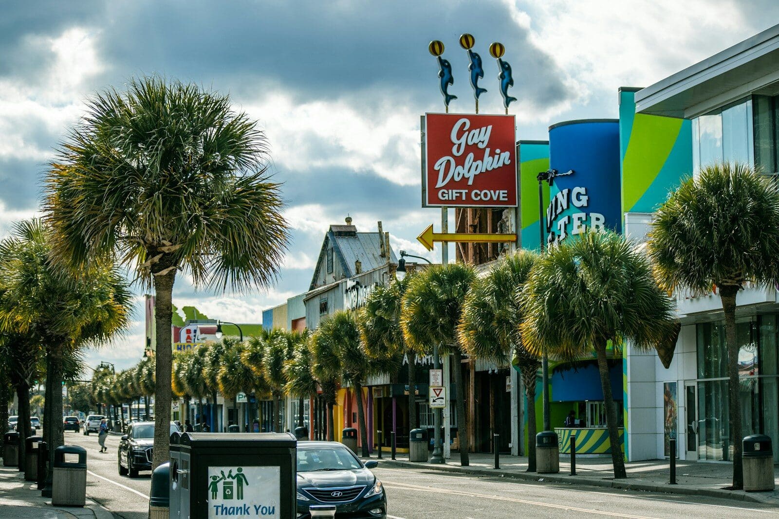 a street with palm trees and buildings Fun Things to Do in Myrtle Beach for Adults