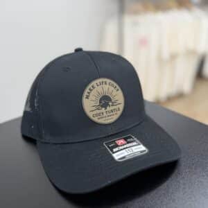 Cozy Turtle leather patch trucker hat on black Richardson 112 hat