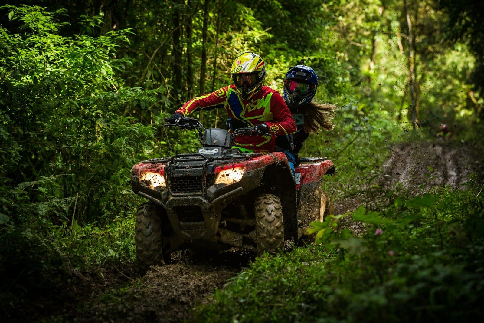 man and woman riding on ATV Riverneck Acres ATV Park Guide For Campers, Riders, And Outdoor Families